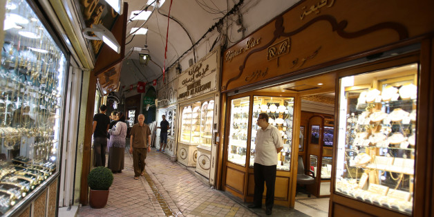 A shopkeeper (R) waits for customers at his jewellery shop in the old quarters in Tunis, Tunisia August 10, 2016. REUTERS/Zoubeir Souissi