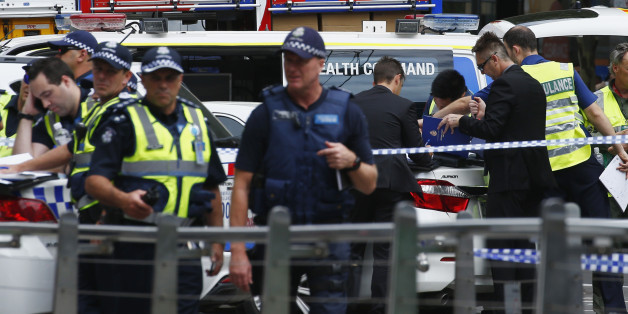 Police and emergency services personnel are seen after police cordoned off Bourke Street mal, after a car hit pedestrians in central Melbourne, Australia, January 20, 2017. REUTERS/Edgar Su