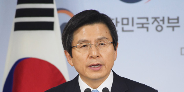 South Korean Prime Minister Hwang Kyo Ahn delivers an address to the nation as acting president in Seoul on Dec. 9, 2016, after the country's parliament voted to impeach President Park Geun Hye over a corruption scandal. (Photo by Kyodo News via Getty Images)