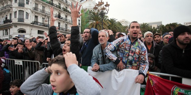 ALGIERS, ALGERIA - JANUARY 19: Soccer fans of Algeria watch their national team's match against Tunisia on the giant screen at Al Barid square, during 2017 Africa Cup of Nations, in Algiers, Algeria on January 19, 2017. (Photo by Bechir Ramzy/Anadolu Agency/Getty Images)