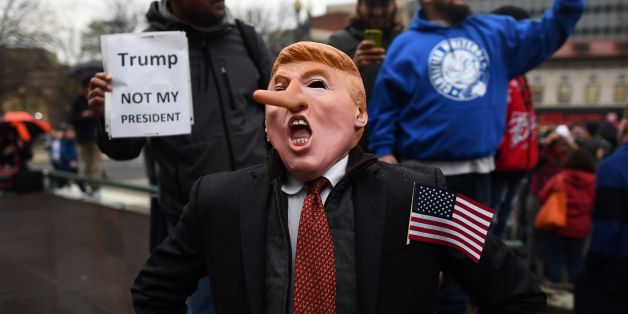 Demonstrators protest against US President-elect Donald Trump before his inauguration on January 20, 2017, in Washington, DC.
Donald Trump will be sworn in as the 45th president of the United States Friday -- capping his improbable journey to the White House and beginning a four-year term that promises to shake up Washington and the world. / AFP / Jewel SAMAD (Photo credit should read JEWEL SAMAD/AFP/Getty Images)