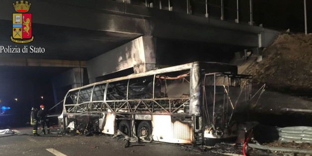 A charred bus, which was carrying Hungarian students, is seen on a side of a highway, near Verona, northern Italy, January 21, 2017. Italian Police/Handout via REUTERS ATTENTION EDITORS - THIS IMAGE WAS PROVIDED BY A THIRD PARTY. EDITORIAL USE ONLY. TPX IMAGES OF THE DAY