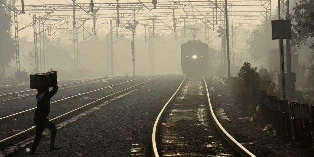NEW DELHI, INDIA - JANUARY 11: Trains running late due to fog at Tilak Bridge Railway Station on January 11, 2017 in New Delhi, India. Delhi today witnessed the coldest day of the season with temperature falling to 2.3 degrees Celsius at some parts of the national capital region. (Photo by Arvind Yadav/Hindustan Times via Getty Images)