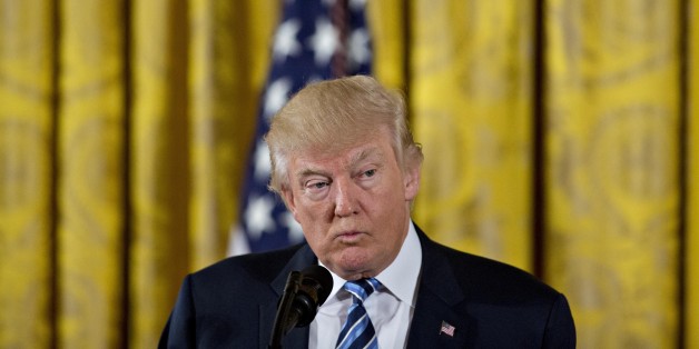 U.S. President Donald Trump pauses while speaking during a swearing in ceremony of White House senior staff in the East Room of the White House in Washington, D.C., U.S., on Sunday, Jan. 22, 2017. Trump today mocked protesters who gathered for large demonstrations across the U.S. and the world on Saturday to signal discontent with his leadership, but later offered a more conciliatory tone, saying he recognized such marches as a hallmark of our democracy. Photographer: Andrew Harrer/Bloomberg via Getty Images