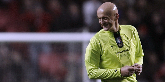 Former FIFA soccer referee Pierluigi Collina of Italy smiles during the seventh "Match against Poverty" at Luz stadium in Lisbon January 25, 2010. With tickets at 10 euros each, the match will raise funds for victims of a manitude-7 quake on January 12 in Haiti which killed more than 200,000 people, leaving up to three million hurt or homeless in nightmarish conditions in the Western Hemisphere's poorest country. REUTERS/Nacho Doce (PORTUGAL - Tags: SPORT SOCCER)