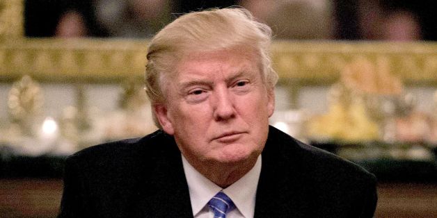 US President Donald Trump looks on during a reception with Congressional leaders on January 23, 2017 at the White House in Washington, DC. / AFP / NICHOLAS KAMM (Photo credit should read NICHOLAS KAMM/AFP/Getty Images)