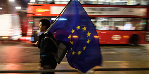 LONDON, ENGLAND - JANUARY 24: A man carries a European Union flag outside the Supreme Court in Parliament Square ahead of the ruling on whether Parliament have the power to begin the Brexit process, on January 24, 2017 in London, England. The judgement will play an important role in how the Government proceeds with it's planned use of the EU's Article 50 exit clause. (Photo by Leon Neal/Getty Images)