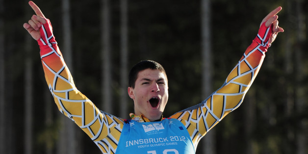 PATSCHERKOFEL, AUSTRIA - JANUARY 14: Adam Lamhamedi of Morocco celebrtates after winning the gold medal at the Alpine Skiing Men's Super-G race on January 14, 2012 in Patscherkofel, Austria. (Photo by Shaun Botterill/Getty Images)
