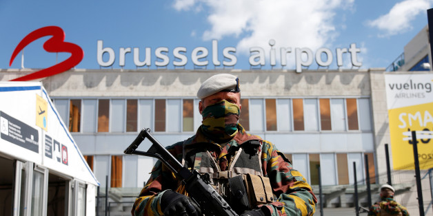 A Belgian soldier stands guard outside the partially reopened departure hall of Zaventem international airport near Brussels, Belgium, May 3, 2016. REUTERS/Francois Lenoir
