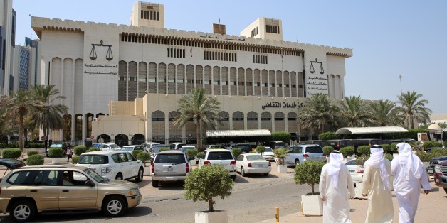 Kuwaitis arrive at the Palace of Justice where the sentence hearing of 29 defendants for their roles in a deadly Shiite mosque bombing claimed by the Islamic State group, takes place on September 15, 2015 in Kuwait City. A Kuwaiti court sentenced seven people to death, five of them in absentia, on charges of helping a Saudi suicide bomber carry out the June 26 attack, which killed 26 Shiite worshippers and wounded 227. AFP PHOTO / YASSER AL-ZAYYAT (Photo credit should read YASSER AL-ZAYYA