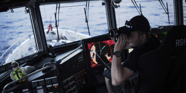 AT SEA - FEBRUARY 29: Norwegian Redningsselskapet rescue boat 'Peter Henry Von Koss' conducts a Frontex sea patrol on the northern shores of Lesbos island on February 29, 2016. Crew officer Andras Johansen (L) on the watch with binoculars for eventual refugee boats. Refugee boats would be monitored until they reach the Greek coast but no ID control is made at sea. Lesbos, the Greek vacation island in the Aegean Sea between Turkey and Greece, faces massive refugee flows from the Middle East countries. (Photo by Etienne De Malglaive/Getty Images)