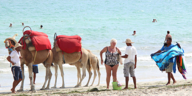 Souvenir vendors try to sell items to tourists on the island of Djerba, Tunisia, September 7, 2016. REUTERS/Zoubeir Souissi