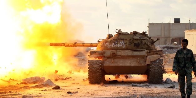 Members of the Libyan National Army (LNA) fire a tank during fighting against jihadists in Qanfudah, on the southern outskirts of Benghazi, on January 14, 2017.Khalifa Haftar's forces, which call themselves the Libyan National Army (LNA), have battled jihadists in second city Benghazi for more than two years and control key eastern oil export terminals. / AFP / Abdullah DOMA (Photo credit should read ABDULLAH DOMA/AFP/Getty Images)