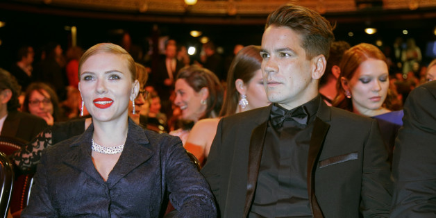 U.S. actress Scarlett Johansson and her partner Romain Dauriac attend the 39th Cesar Awards ceremony in Paris February 28, 2014. REUTERS/Jacky Naegelen (FRANCE - Tags: ENTERTAINMENT)