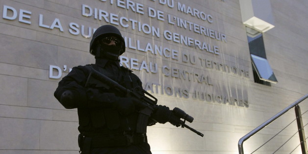 A Moroccan policeman stands guard at the Central Bureau of Judicial Investigation office in Sale, March 23, 2015. Moroccan authorities said on Monday they had dismantled a militant cell planning to create an Islamic State affiliate in the North African kingdom, seizing guns and accusing its members of plotting attacks. Reporters were shown six pistols and ammunition seized from a hideout near the southern city of Agadir, in the offices of the BCIJ in the city of Sale. REUTERS/Stringer