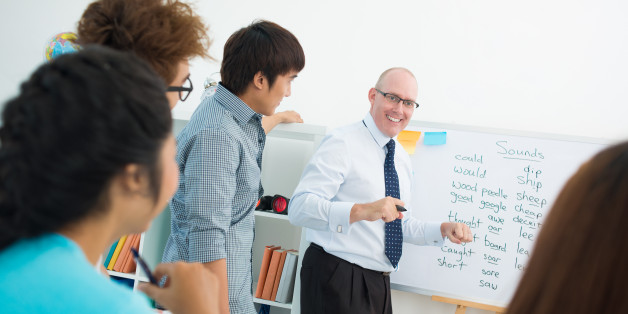 Students trying to guess the English word their teacher keeps in mind while giving a hint