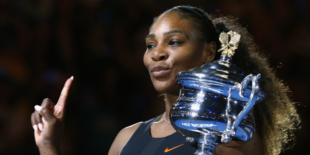 Tennis - Australian Open - Melbourne Park, Melbourne, Australia - 28/1/17 Serena Williams of the U.S. gestures as she holds her trophy after winning her Women's singles final match against Venus Williams of the U.S. .REUTERS/Edgar Su