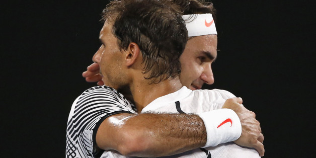 Tennis - Australian Open - Melbourne Park, Melbourne, Australia - 29/1/17 Switzerland's Roger Federer embraces after winning his Men's singles final match against Spain's Rafael Nadal. REUTERS/Issei Kato