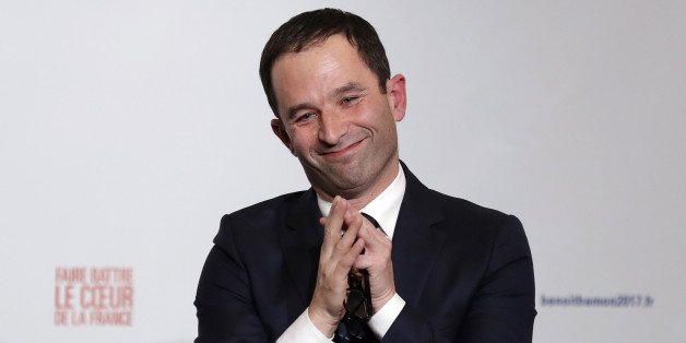 Former French education minister Benoit Hamon reacts after partial results in the second round of the French left's presidential primary election in Paris, France, January 29, 2017. REUTERS/Christian Hartmann