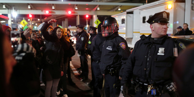 Protesters gather outside Terminal 4 at JFK airport in opposition to U.S. president Donald Trump's proposed ban on immigration in Queens, New York City, U.S., January 28, 2017. REUTERS/Stephen Yang