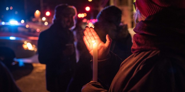 People come to show their support after a shooting occurred in a mosque at the Québec City Islamic cultural center on Sainte-Foy Street in Quebec city on January 29, 2017.Two arrests have been made after five people were reportedly shot dead in an attack on a mosque in Québec City, Canada. / AFP / Alice Chiche (Photo credit should read ALICE CHICHE/AFP/Getty Images)