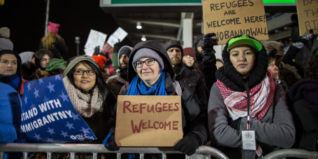 NEW YORK, NY - JANUARY 28: Protestors rally during a demonstration against the Muslim immigration ban at John F. Kennedy International Airport on January 28, 2017 in New York City. President Trump signed an executive order to suspend refugee arrivals and people with valid visa from Iran, Iraq, Libya, Somalia, Sudan, Syria and Yemen. (Photo by Maite H. Mateo/Corbis via Getty Images)