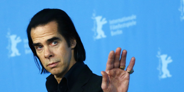 Cast member Nick Cave poses during a photocall promoting the movie "20,000 Days on Earth" at the 64th Berlinale International Film Festival in Berlin February 10, 2014. REUTERS/Thomas Peter (GERMANY - Tags: ENTERTAINMENT)