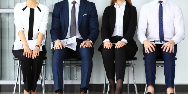 Business people waiting for job interview. Four candidates competing for one position