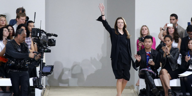 British-born designer Clare Waight Keller appears on the runway after presenting her Spring/Summer 2014 women's ready-to-wear collection for French fashion house Chloe during Paris Fashion Week September 29, 2013. REUTERS/Benoit Tessier (FRANCE - Tags: FASHION)