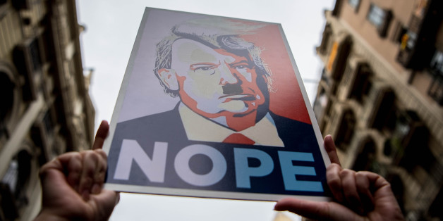 BARCELONA, SPAIN - JANUARY 21: Demonstrators hold posters of Donald Trump as they make their way during the Women's March on January 21, 2017 in Barcelona, Spain. The Women's March originated in Washington DC but soon spread to be a global march calling on all concerned citizens to stand up for equality, diversity and inclusion and for women's rights to be recognised around the world as human rights. Global marches are now being held, on the same day, across seven continents. (Photo by David Ramos/Getty Images)