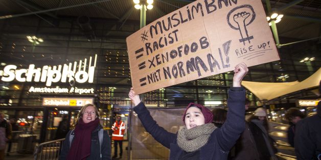 People gather to protest against US President Donald Trump's sweeping executive order, which restricts refugees and travellers from seven Muslim-majority countries, at Schiphol Airport, near Amsterdam, on January 29, 2017. / AFP / ANP / ALEXANDER SCHIPPERS / Netherlands OUT (Photo credit should read ALEXANDER SCHIPPERS/AFP/Getty Images)