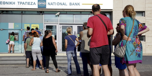 People line up to withdraw cash from an automated teller machine (ATM) outside a National Bank branch in Iraklio on the island of Crete, Greece June 28, 2015. Greece's Prime Minister Alexis Tsipras on Sunday announced a bank holiday and capital controls after Greeks responded to his surprise call for a referendum on bailout terms by pulling money out of banks. REUTERS/Stefanos Rapanis