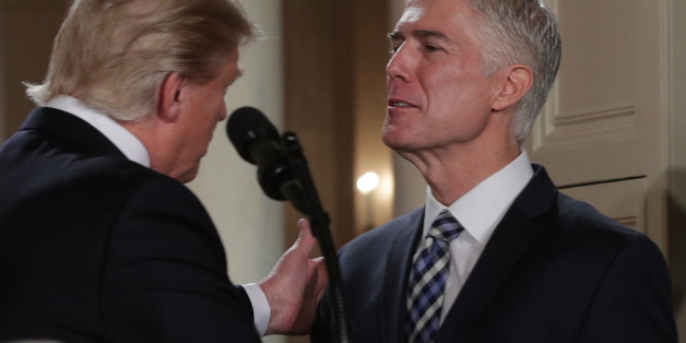 WASHINGTON, DC - JANUARY 31: U.S. President Donald Trump pats on the shoulder of Judge Neil Gorsuch after he nominates him to the Supreme Court during a ceremony in the East Room of the White House January 31, 2017 in Washington, DC.Ã ÃIf confirmed, Gorsuch would fill the seat left vacant with the death of Associate Justice AntoninÃScaliaÃin February 2016.Ã (Photo by Alex Wong/Getty Images)