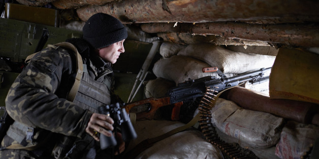 AVDIIVKA, UKRAINE - JANUARY 8: A Ukrainian serviceman stands guard in a trench in the frontline city of Avdiivka as Ukrainian forces pushed back an attack by pro-Russian rebels on January 8, 2016 in Avdiivka, Ukraine. German Chancellor Angela Merkel has said she believes there could be progress in negotiations on the Ukraine crisis over the next few months as the Normandy negotiations take place between France, Germany, Russia and Ukraine. (Photo by Pierre Crom/Getty Images)