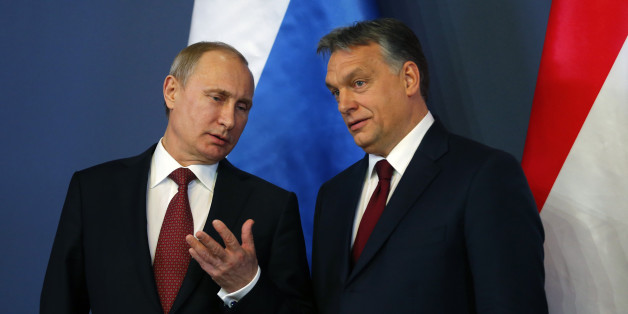 Russian President Vladimir Putin and Hungarian Prime Minister Viktor Orban (R) arrive for a joint news conference in Budapest February 17, 2015. Putin will discuss Russian gas supplies to Hungary when he visits Budapest on Tuesday, an adviser to the Russian president said on Monday. REUTERS/Laszlo Balogh (HUNGARY - Tags: POLITICS)