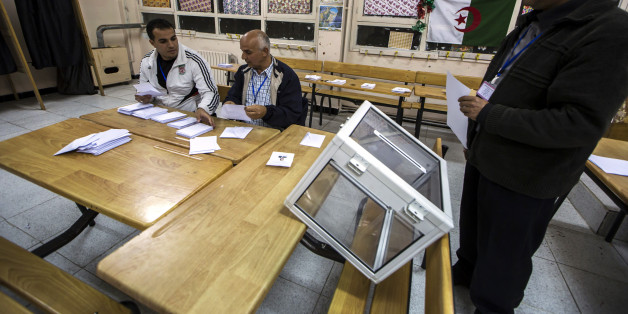 Election workers count ballots at the end of voting for presidential election at a polling station in Algiers April 17, 2014. Algerians voted on Thursday in an election President Abdelaziz Bouteflika is expected to win after 15 years in power, despite speaking only rarely in public since suffering a stroke in 2013. REUTERS/Zohra Bensemra (ALGERIA - Tags: POLITICS ELECTIONS)