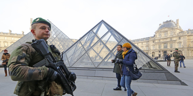 Armed French soldiers patrol at the Louvre Museum as emergency security measures continue ahead of New Year's eve celebrations in and around the French capital, in Paris, France, December 30, 2016. REUTERS/Jacky Naegelen