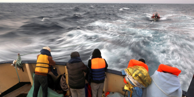 Migrants are seen at the stern of the former fishing trawler Golfo Azzurro of the Spanish NGO Proactiva Open Arms, a day after they were rescued along with other migrants near the coasts of Libya, in the central Mediterranean Sea, January 28, 2017. REUTERS/Giorgos Moutafis