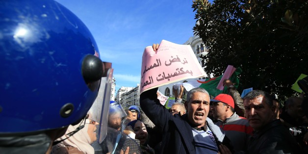 An Algerian trade unionist shouts slogans as they gather outside the People's National Assembly bulding in the capital Algiers on November 27, 2016, to portest the pension reform that is set to be debated by deputies. (Photo by Billal Bensalem/NurPhoto via Getty Images)