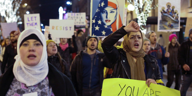 People march through downtown Seattle during a protest held in response to President Donald Trump's travel ban, in Seattle, Washington, U.S. January 29, 2017. REUTERS/David Ryder