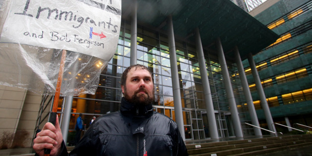 SEATTLE, WA - FEBRUARY 03: Patrick Wicklund, from Seattle, stands outside the U.S. District Court, Western Washington, on February 3, 2017 in Seattle, Washington. Washington state Attorney General Bob Ferguson filed a state lawsuit challenging key sections of President Trump's immigration Executive Order as illegal and unconstitutional. Wicklund says he wanted to show support for refugees and immigrants who are his neighbors and to Bob Ferguson for standing up for an executive order he thinks is