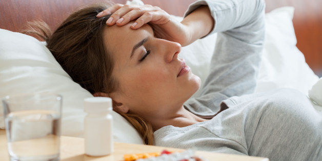 Horizontal view of woman suffering from flu