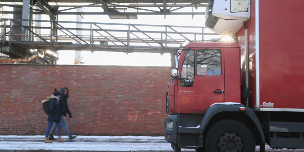 BERLIN, GERMANY - JANUARY 05: People walk past a truck parked in Friedrich-Krause-Ufer street on January 5, 2017 in Berlin, Germany. According to police, Anis Amri, the Tunisian man German authorities are certain drove a heavy truck into a crowded Christmas market on December 19 and killed 12 people, shot a Polish truck driver and hijacked his truck in Friedrich-Krause-Ufer street shortly before using the truck in the attack. (Photo by Sean Gallup/Getty Images)