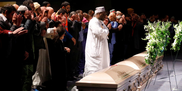 People pray during a funeral ceremony for three of the victims of the deadly shooting of the Quebec Islamic Cultural Centre at the Congress Center in Quebec City, February 3, 2017. REUTERS/Mathieu Belanger