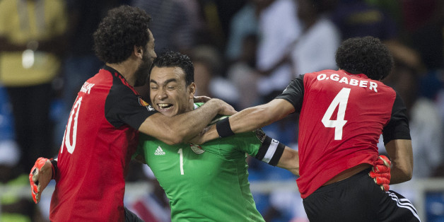 LIBREVILLE, GABON - FEBRUARY 01: Goalkeeper ESSAM KAMAL TAWFIK ELHADARY of Egypt celebrates winning the match with MOHAMED SALAH and OMAR MAHMOUD SAYED GABER during the semi-final match between Burkina Faso and Egypt at Stade de L'Amitie on February 01, 2017 in Libreville, Gabon. (Photo by Visionhaus/Corbis via Getty Images)