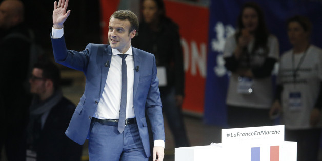 Emmanuel Macron, head of the political movement En Marche !, or Onwards !, and candidate for the 2017 presidential election, arrives on stage during a campaign rally in Lyon, France, February 4, 2017. REUTERS/Robert Pratta
