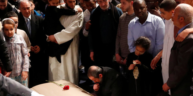 People mourn during a funeral ceremony for three of the victims of the deadly shooting of the Quebec Islamic Cultural Centre at the Congress Center in Quebec City, February 3, 2017. REUTERS/Mathieu Belanger