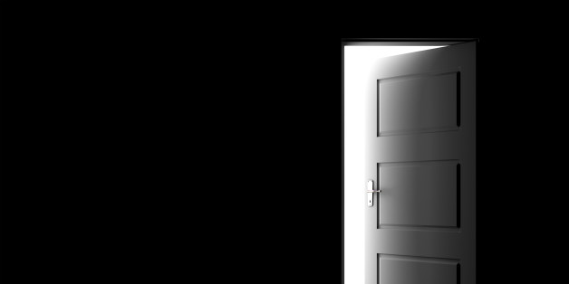 Open door in a dark room