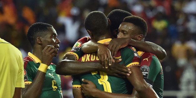 Cameroon's defender Nicolas Nkoulou is congratulated by team mates after scoring a goal during the 2017 Africa Cup of Nations final football match between Egypt and Cameroon at the Stade de l'Amitie Sino-Gabonaise in Libreville on February 5, 2017. / AFP / ISSOUF SANOGO (Photo credit should read ISSOUF SANOGO/AFP/Getty Images)