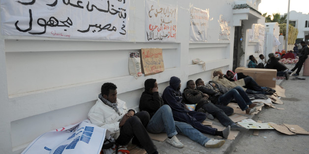 African refugees camp outside the headquarters of the High Commissioner for Refugees (UNHCR) in Tunis on April 3, 2013, as they participate in a hunger strike to demand their resettlement outside Tunisia. AFP PHOTO / FETHI BELAID (Photo credit should read FETHI BELAID/AFP/Getty Images)
